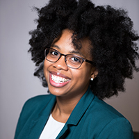 Lataevia Berry headshot in green blazer